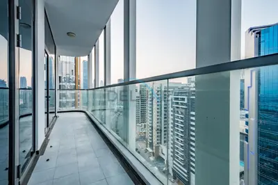 a balcony in a skyscraper with views of a city at Upscale 3BR Apartment in Bayz Tower, Business Bay by Deluxe Holiday Homes in Dubai