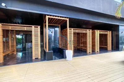 a building with wooden shutters on the side of it at Upscale 3BR Apartment in Bayz Tower, Business Bay by Deluxe Holiday Homes in Dubai