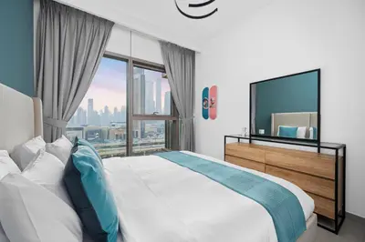 a bedroom with a large bed and a large window at Arthouse Views - Burj Khalifa view & Dubai Mall access in Dubai