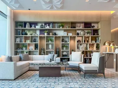 a living room with a couch and two chairs at Waves - Luxurious 11th Floor Retreat in Palace Residences in Dubai