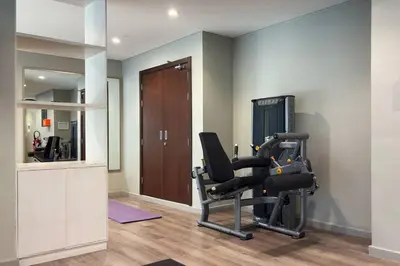a room with a gym with a exercise bike at Waves - Canal-View Elegance 1BR Apt in Reva Residences in Dubai