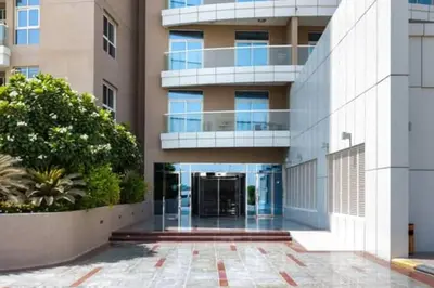 an external view of a building with a courtyard at Stylish Studio With Amazing View in Dubai
