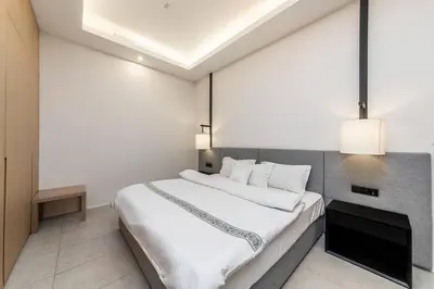 a bedroom with a large bed with white sheets at Palm Jumeirah Studio Sea View Royal Amwaj in Dubai