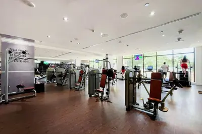 a gym with treadmills and cardio equipment in a room at Palm Jumeirah Sea View 1Bdr in Dubai