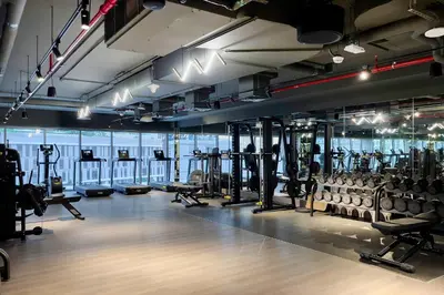 a gym with lots of treadmills and machines at Downtown Studio Sterling WEST in Dubai