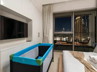 a room with a bed and a view of a city at Premium Two-Bedroom Apartment with Private Balcony & Full Burj Khalifa Views by Al Fannan Holiday Homes in Dubai
