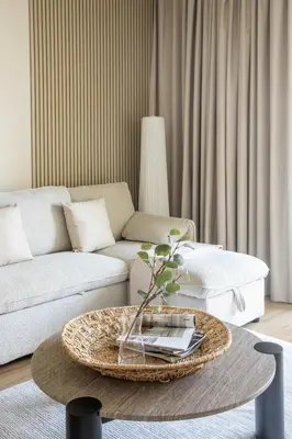 a living room with a couch and a coffee table at Frank Porter - Al Dhafrah 2 in Dubai