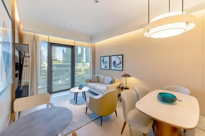 a living room with a table and chairs at FAM Living - Address Residences Opera - Luxurious 2Bed in Dubai