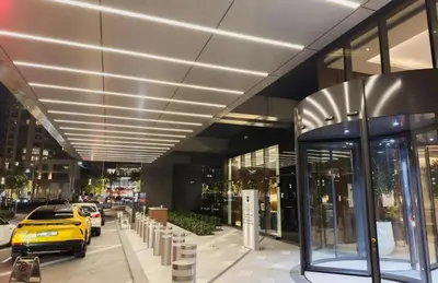 a yellow car parked in front of a building at FAM Living - Address Residences Opera - Luxurious 2Bed in Dubai