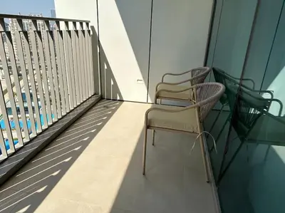 two chairs sitting on top of a balcony at Your Dubai Home in Dubai