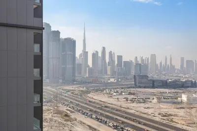 a view of a city skyline from a building at STAY BY LATINEM Luxury 1BR Holiday Home CVR B2303 near Burj Khalifa in Dubai