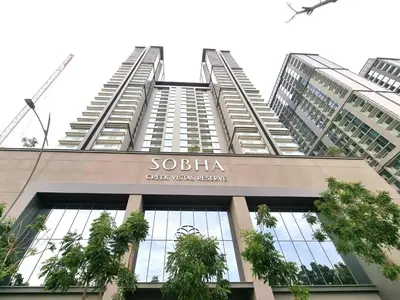 a tall building with a sign on top of it at STAY BY LATINEM Luxury 1BR Holiday Home CVR B2303 near Burj Khalifa in Dubai