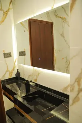 a bathroom with a large mirror and a sink at Stunning SeaView Elite Residence Dubai Marina in Dubai