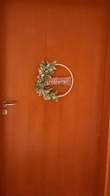 a brown door with a welcome sign on it at Elegant 1BR Apartment in Dubai LuxuryStay in Dubai