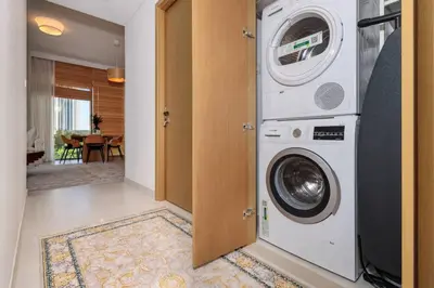 a washer and dryer sitting in a room at 3 BR Dubai Creek Harbour in Dubai