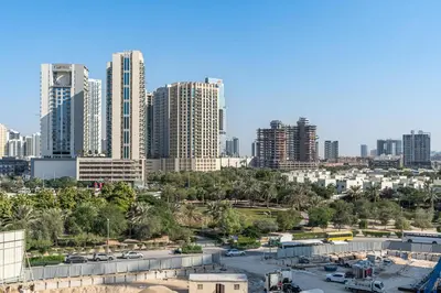 a view of a city with tall buildings at Modern Studio with Pool, Gym and BBQ area in Dubai