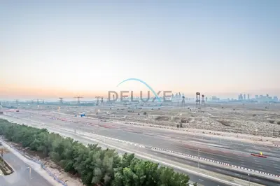 an aerial view of a highway with the gateway arch at Elegant Studio in Bloom Towers B, JVC by Deluxe Holiday Homes in Dubai
