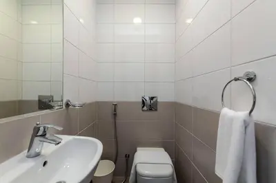 a bathroom with a sink and a toilet at Free Netflix, Sea View, Private Beach & Pool in Dubai