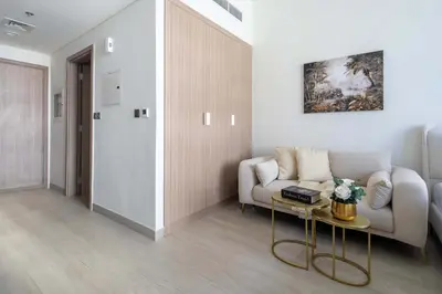 a living room with a couch and a table at Frank Porter - Azizi Riviera 28 in Dubai