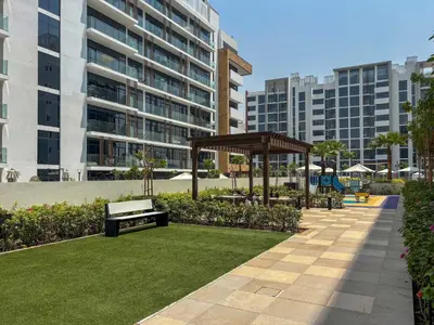 a park with a bench and a gazebo at Frank Porter - Azizi Riviera 28 in Dubai
