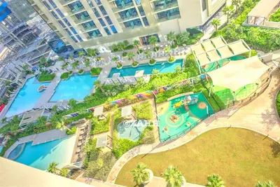an aerial view of a pool at a resort at Business bay Chic Apartment in Dubai