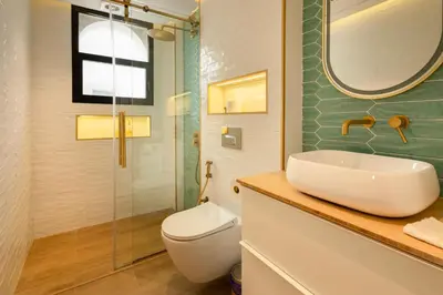 a bathroom with a sink and a toilet and a mirror at Luxurious Villa 5BHK with Pool BBQ and Full Time Housemaid Assistance - live in in Dubai