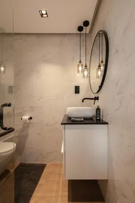 a bathroom with a sink and a mirror at Luxurious Villa 5BHK with Pool BBQ and Full Time Housemaid Assistance - live in in Dubai