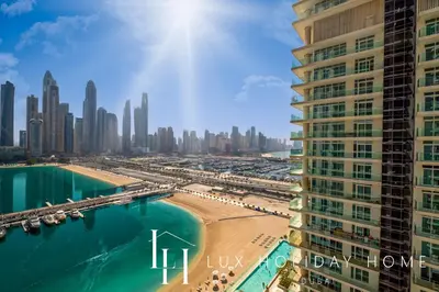 a view of the city of dubai from a skyscraper at LUX The Marina Vista Beachfront Suite 4 in Dubai