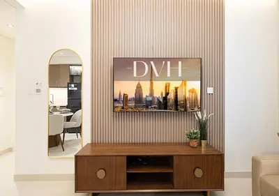 a living room with a table and a mirror at Stylish Downtown Retreat, Burj Crown, Opera & Boulevard View in Dubai