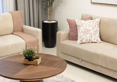 a living room with a couch and a coffee table at Stylish Downtown Retreat, Burj Crown, Opera & Boulevard View in Dubai