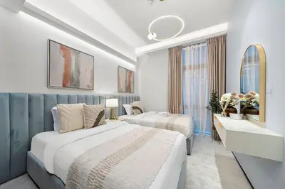 a hotel room with two beds and a window at FIRST CLASS 3BR Lively Sanctuary in Dubai