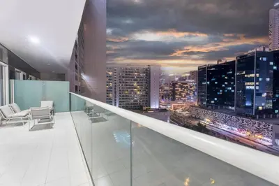 an office with a view of a city skyline at FIRST CLASS 2BR Luxury Urban Escape in Dubai
