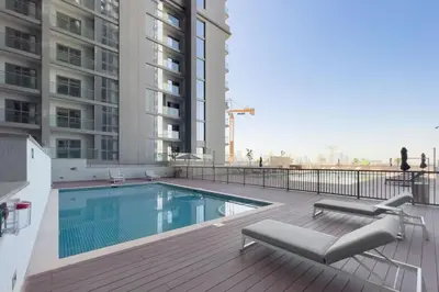 a swimming pool on the balcony of a building at GuestReady - Family retreat at Sobha Creek Vista in Dubai
