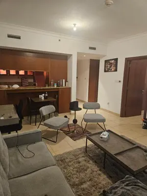 a living room with a couch and chairs and a piano at Fairways north in Dubai