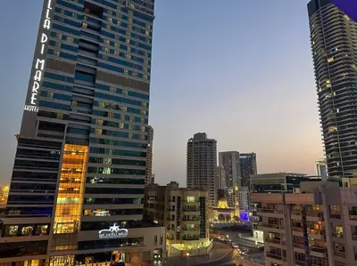 a view of a city skyline with tall buildings at Beautiful Studio Apartment in Dubai