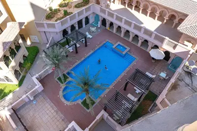 an overhead view of a swimming pool in a building at Al Andalus Tower F, Cadiz JGE - 3BR Apartment - Allsopp & Allsopp in Dubai