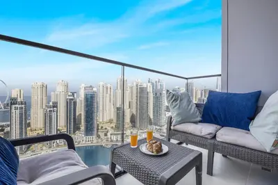 a balcony with a view of a city skyline at EDEN'S Homes & Villas - VIDA Dubai Marina Residences in Dubai