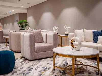 a living room with couches and a table at Elgant 2 bedroom in Dubai
