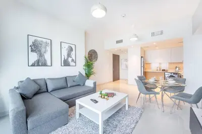 a living room with a couch and a table at Luxury 42-Floor 1BR flat in Harbour Views in Dubai