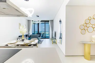 a living room with white walls and a dining room at Panoramic Sea & Palm Views 2BR Address Beach Resort JBR in Dubai