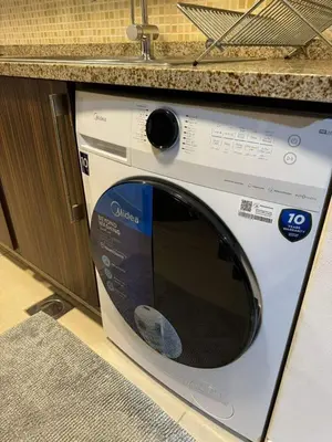 a microwave sitting on a counter in a kitchen at Stunning Apartment - High Floor - Canal View - Goldcrest Exectutive Tower in Dubai