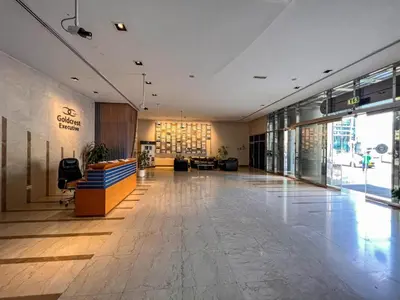 an empty lobby of a building with a large at Stunning Apartment - High Floor - Canal View - Goldcrest Exectutive Tower in Dubai