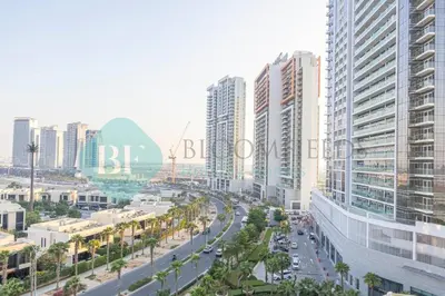 a city with tall buildings and a street with cars at Bloomfields Stu In Carson in Dubai