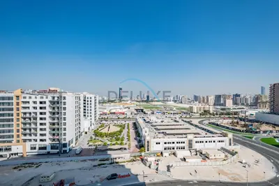 an aerial view of a city with tall buildings at Lovely 1BR in Binghatti Avenue Al Jaddaf by Deluxe Holiday Homes in Dubai