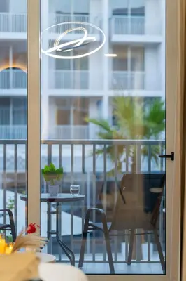 a view of a balcony with a table and chairs at luxury Santorini studio style in Dubai