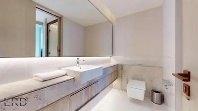 a bathroom with a sink and a mirror at Classy & Cozy 2BR Harbour Point in Dubai