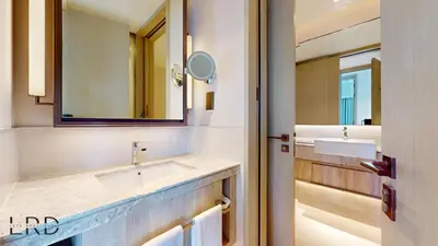 a bathroom with a sink and a mirror at Classy & Cozy 2BR Harbour Point in Dubai
