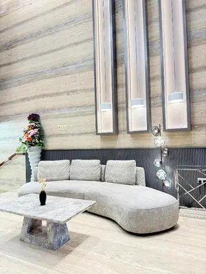 a living room with a couch and a table at luxury Venice holiday home in Dubai