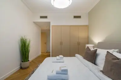 a living room with a white couch in a room at Marina Royale 3 Bedroom Apartment I Luxe Marina Harbour & Yacht Club Views I Nearby to a Beach I Free Pool, Gym, Wi-Fi and Parking I by Meerak in Dubai