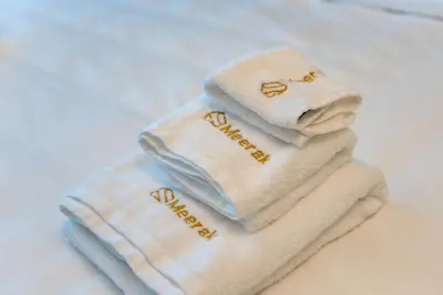 a towel with the words happy new year written on it at Marina Royale 3 Bedroom Apartment I Luxe Marina Harbour & Yacht Club Views I Nearby to a Beach I Free Pool, Gym, Wi-Fi and Parking I by Meerak in Dubai